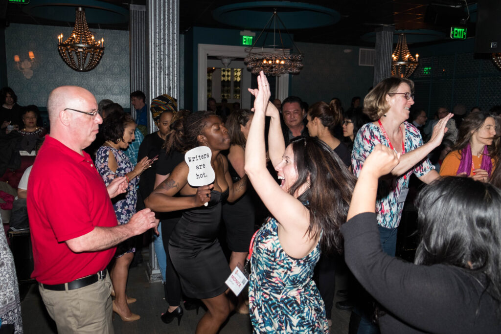 Writers dancing at a Muse party in 2017.